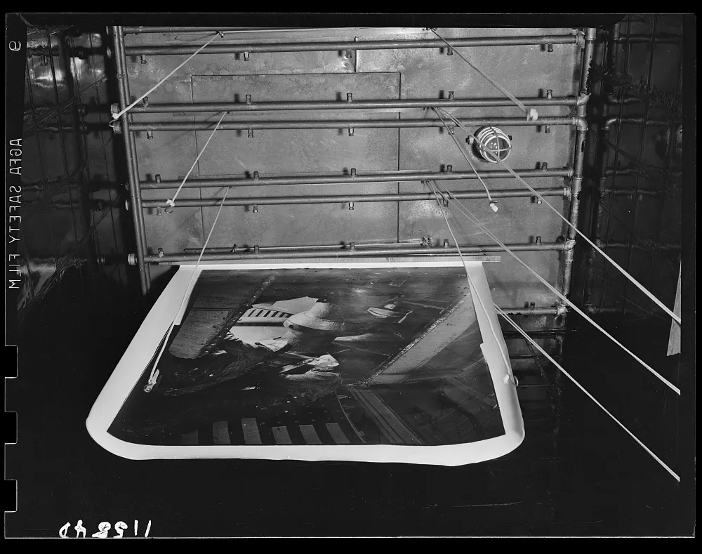 John Ferrell, Shower bath print washer in the FSA photographic laboratory, Washington, D.C. (1942), U.S. Library of Congress, FSA/OWI Collection