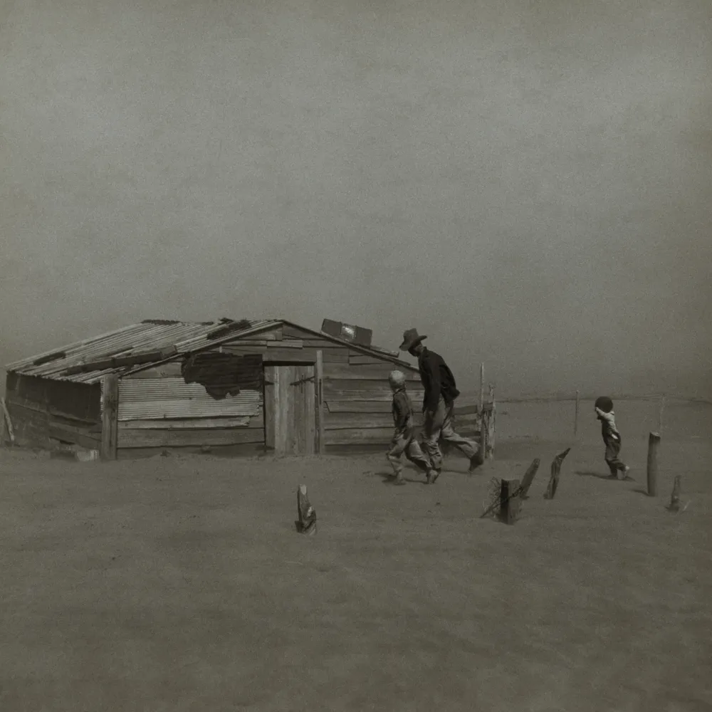 Arthur Rothstein, Farmer and sons walking in the face of a dust storm, Cimarron County, Oklahoma (1936), U.S. Library of Congress / FSA